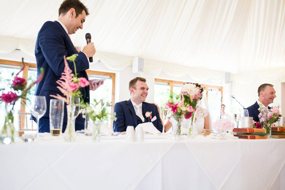 Travel themed wedding_Suffolk_norfolk wedding photography_tatum reid_pastels_world map_pink bridesmaid dresses_natural wedding photography_outside music bill downs (50)