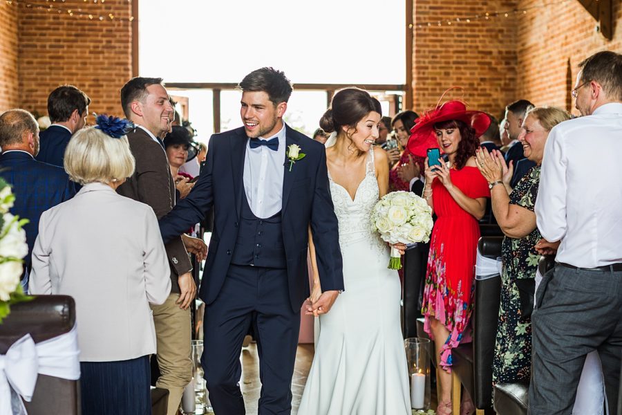 Southwood Hall wedding bride and groom walking down isle