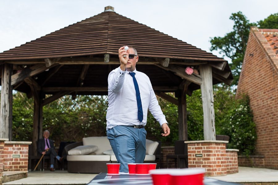 Southwood Hall wedding guest playing beer ping pong